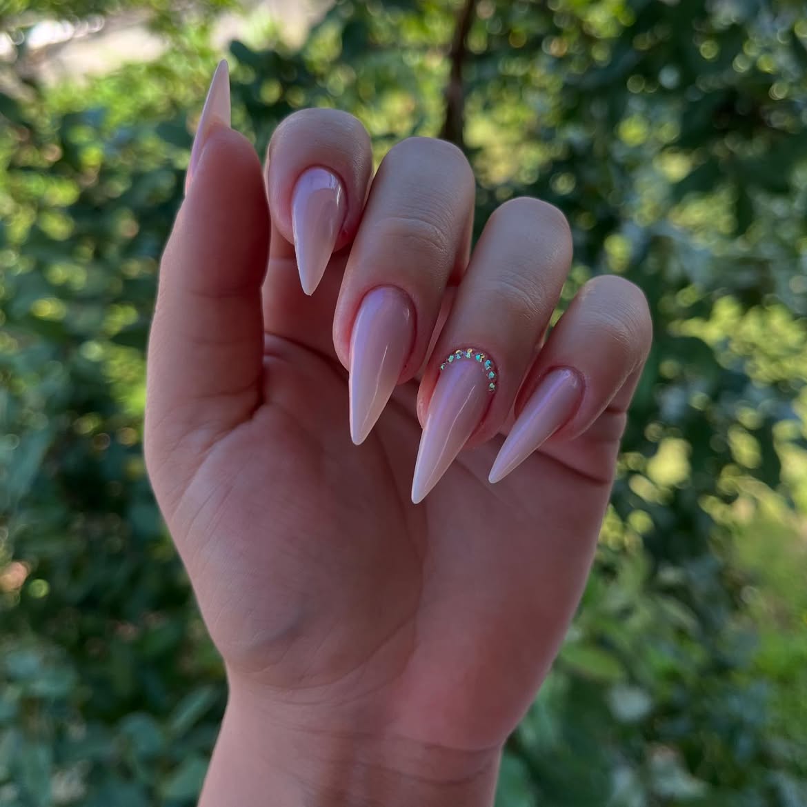 Pearl White Stiletto Nails with Rhinestone Accent
