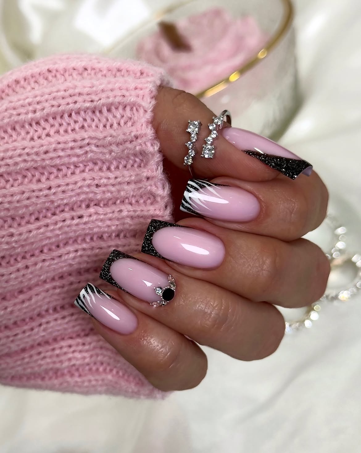Pink French Tip Nails with Black Glitter Accents