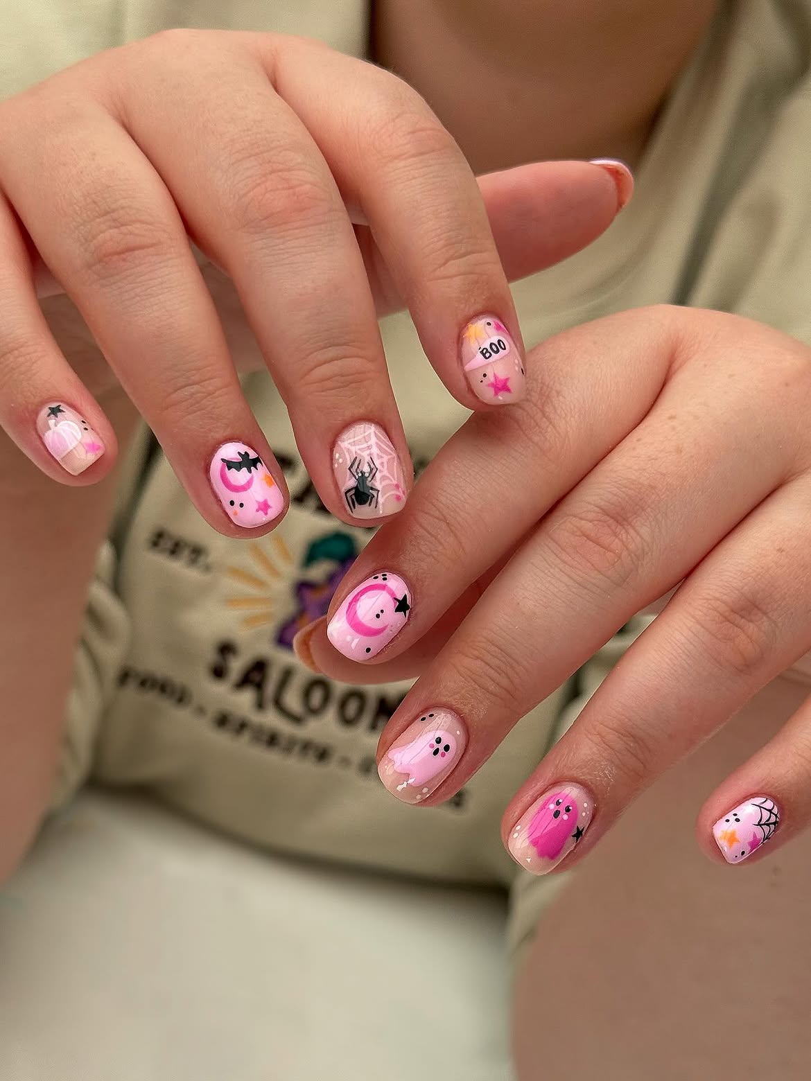 27 Spooktacular Pink Halloween Nail Ideas You Need 16 Pink Ghost & Spiderweb Halloween Nail Art