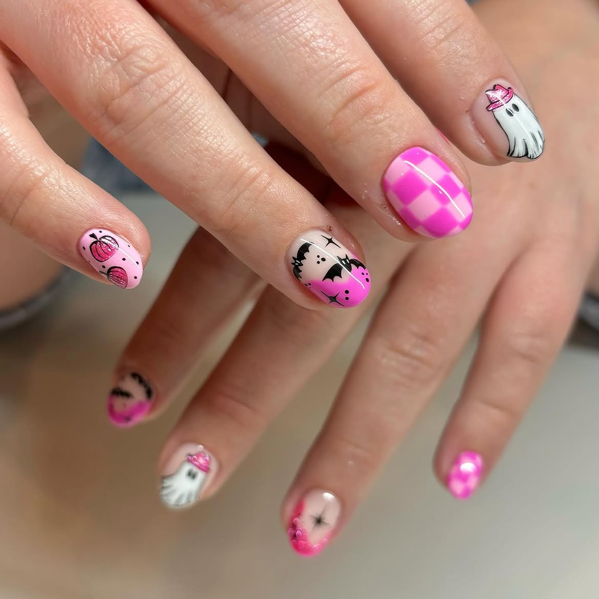 27 Spooktacular Pink Halloween Nail Ideas You Need 22 Pink Halloween Ghost and Pumpkin Checkerboard Nails