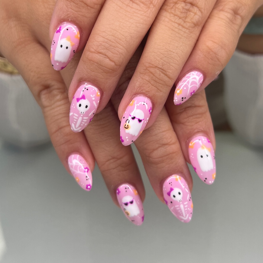 27 Spooktacular Pink Halloween Nail Ideas You Need 10 Pink Halloween Ghost and Skeleton Nail Art