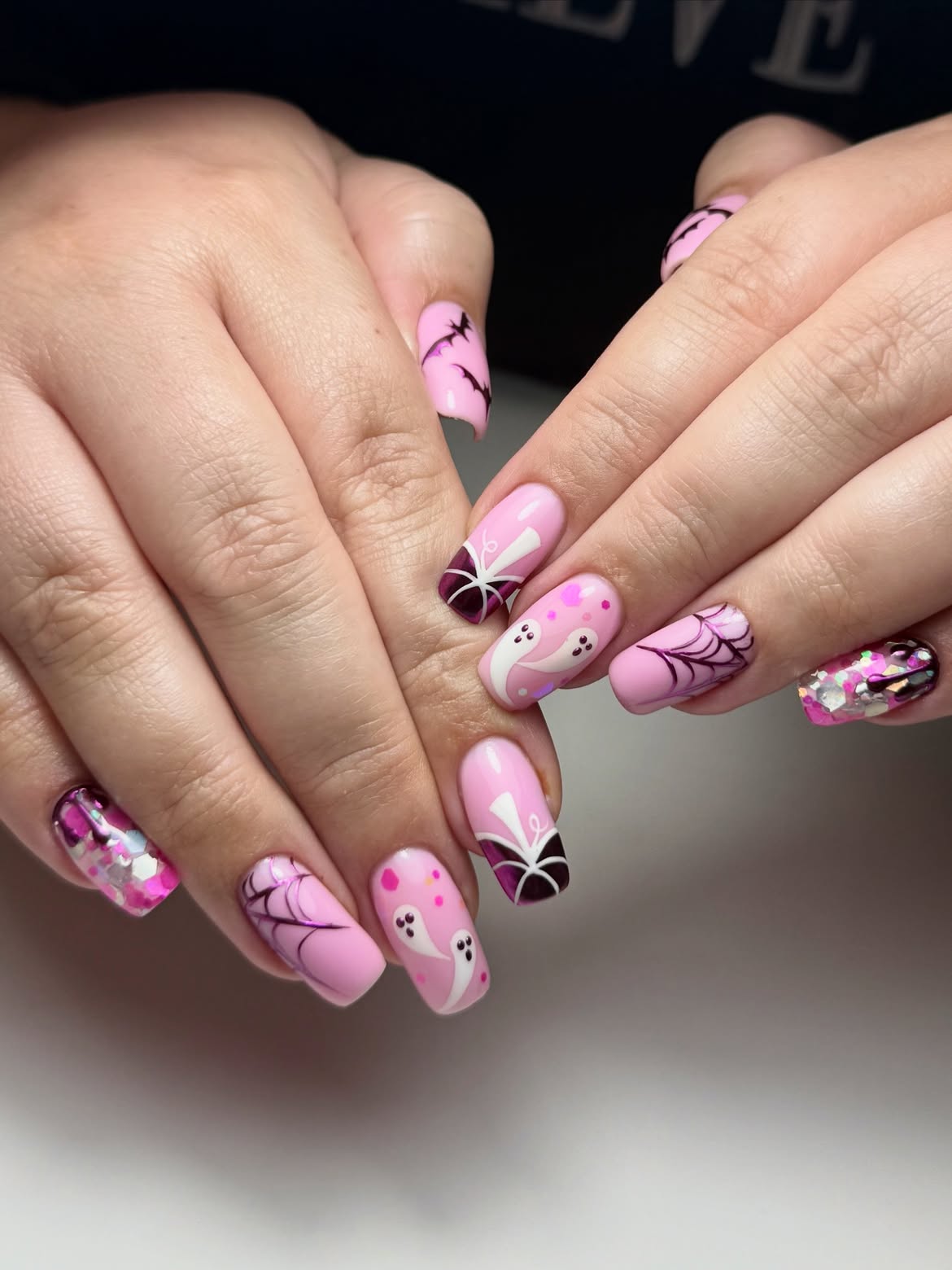 27 Spooktacular Pink Halloween Nail Ideas You Need 17 Pink Halloween Ghosts and Spiderwebs Manicure