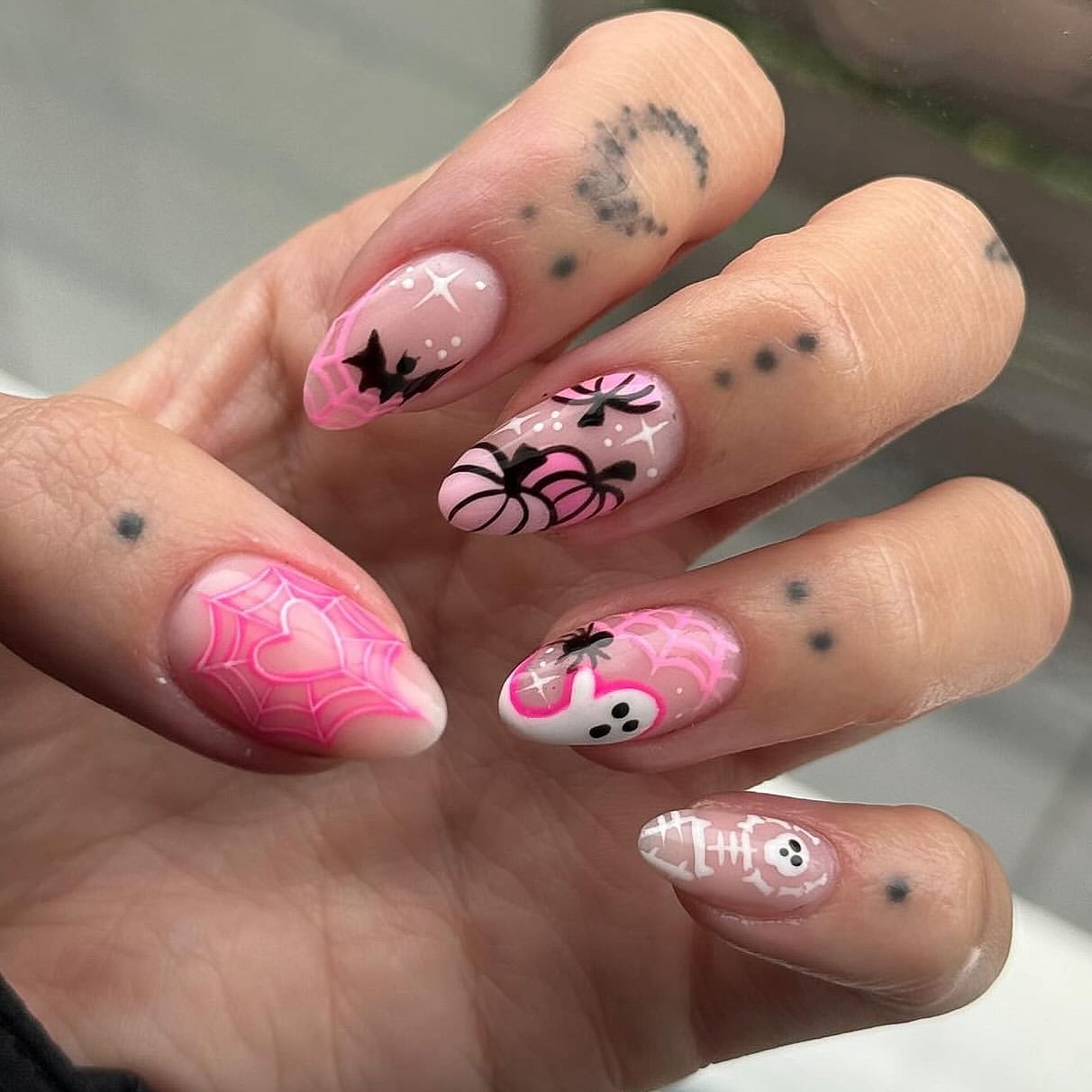 27 Spooktacular Pink Halloween Nail Ideas You Need 5 Pink Halloween Spiderweb & Ghost Almond Nails