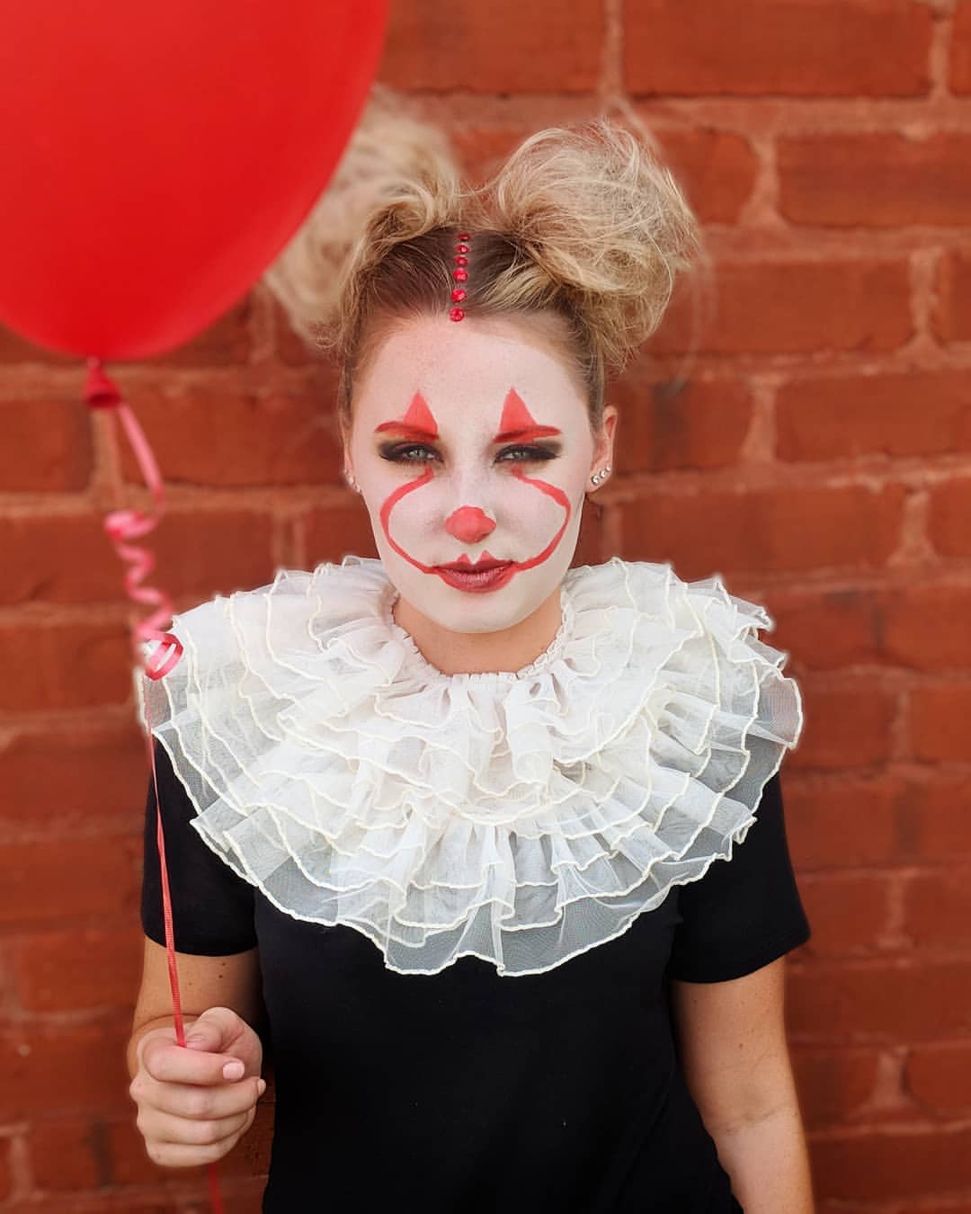 Playful Clown Pigtails With Subtle Blonde Highlights