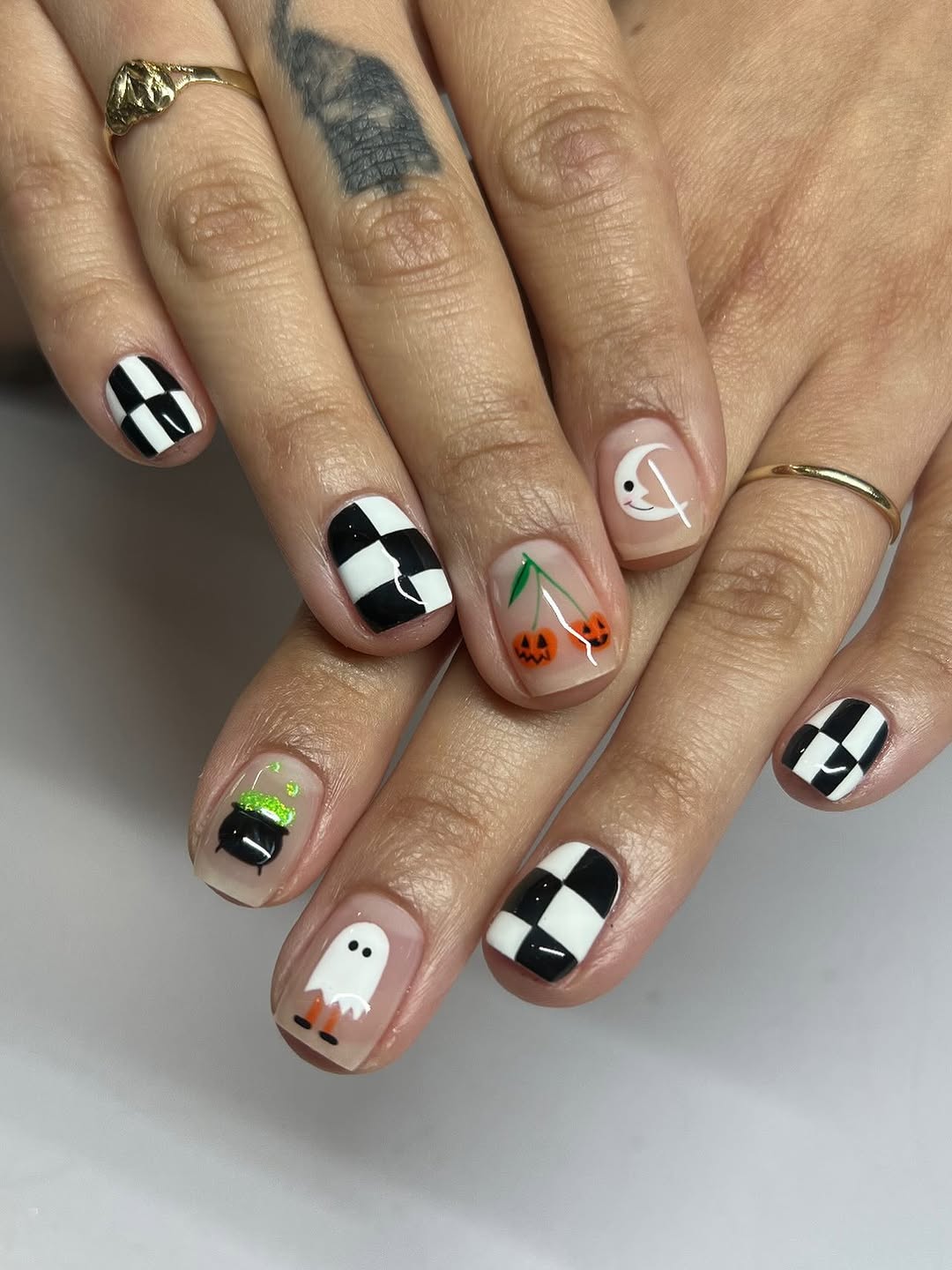 29 Spooky & Chic Halloween Nail Ideas for Short Nails 4 Playful Halloween Ghost & Checkered Short Nails
