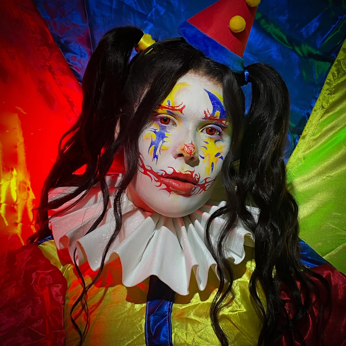 Playful Pigtails With Clown Makeup Vibes