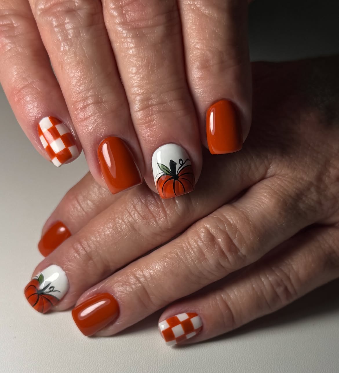28 Stunning Pumpkin Nail Ideas for a Chic Fall Look 23 Pumpkin Patch Checkerboard Fall Nails