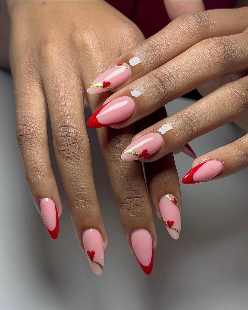 Red French Tip Almond Nails with Gold Heart Detail