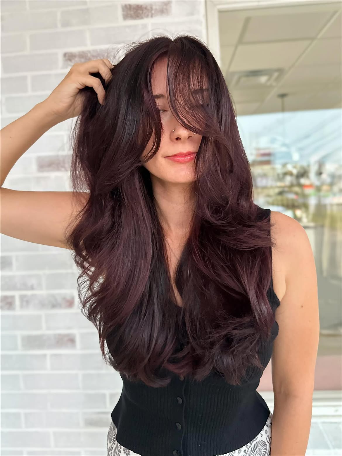 Rich Cherry Cola Balayage With Face-Framing Layers