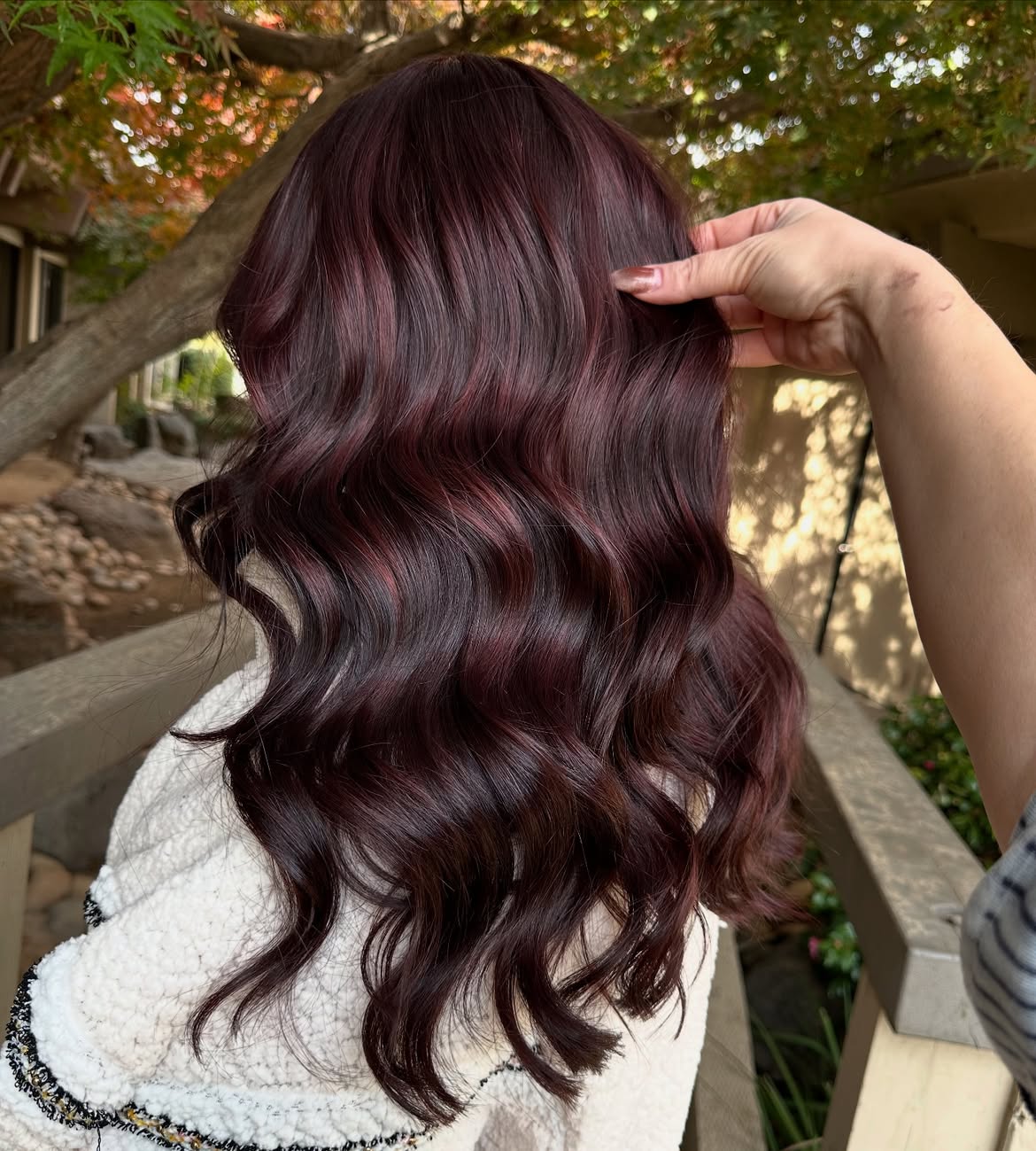 Rich Cherry Cola Balayage With Loose Waves