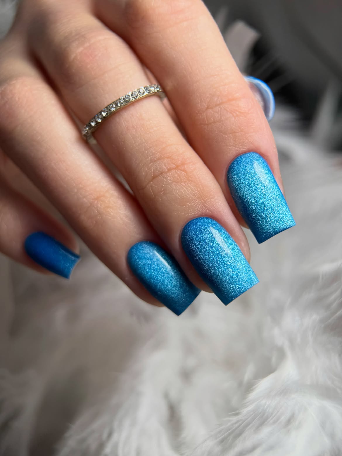 Shimmering Electric Blue Cat Eye Nails