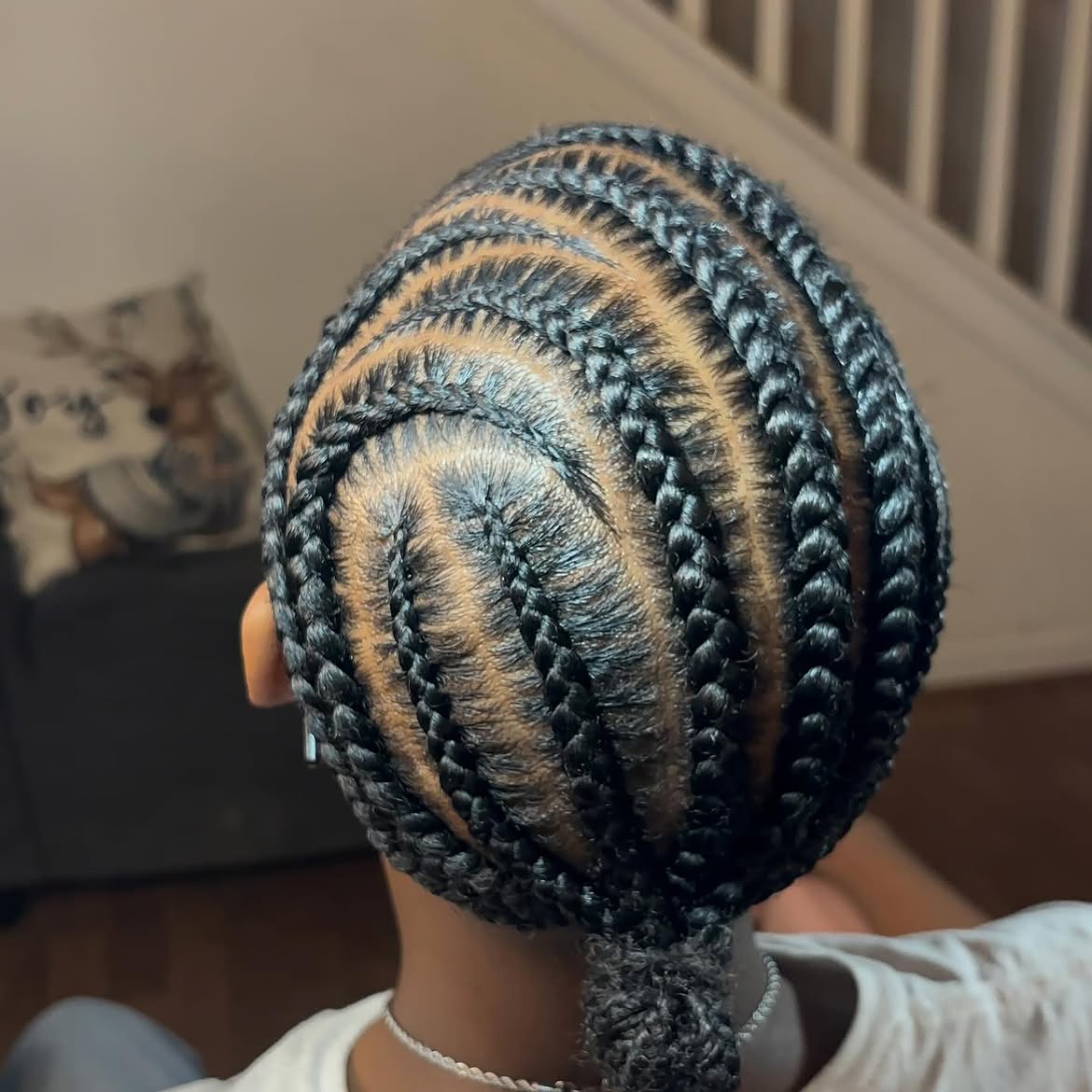 Sleek Cornrow Braids With A Low Ponytail