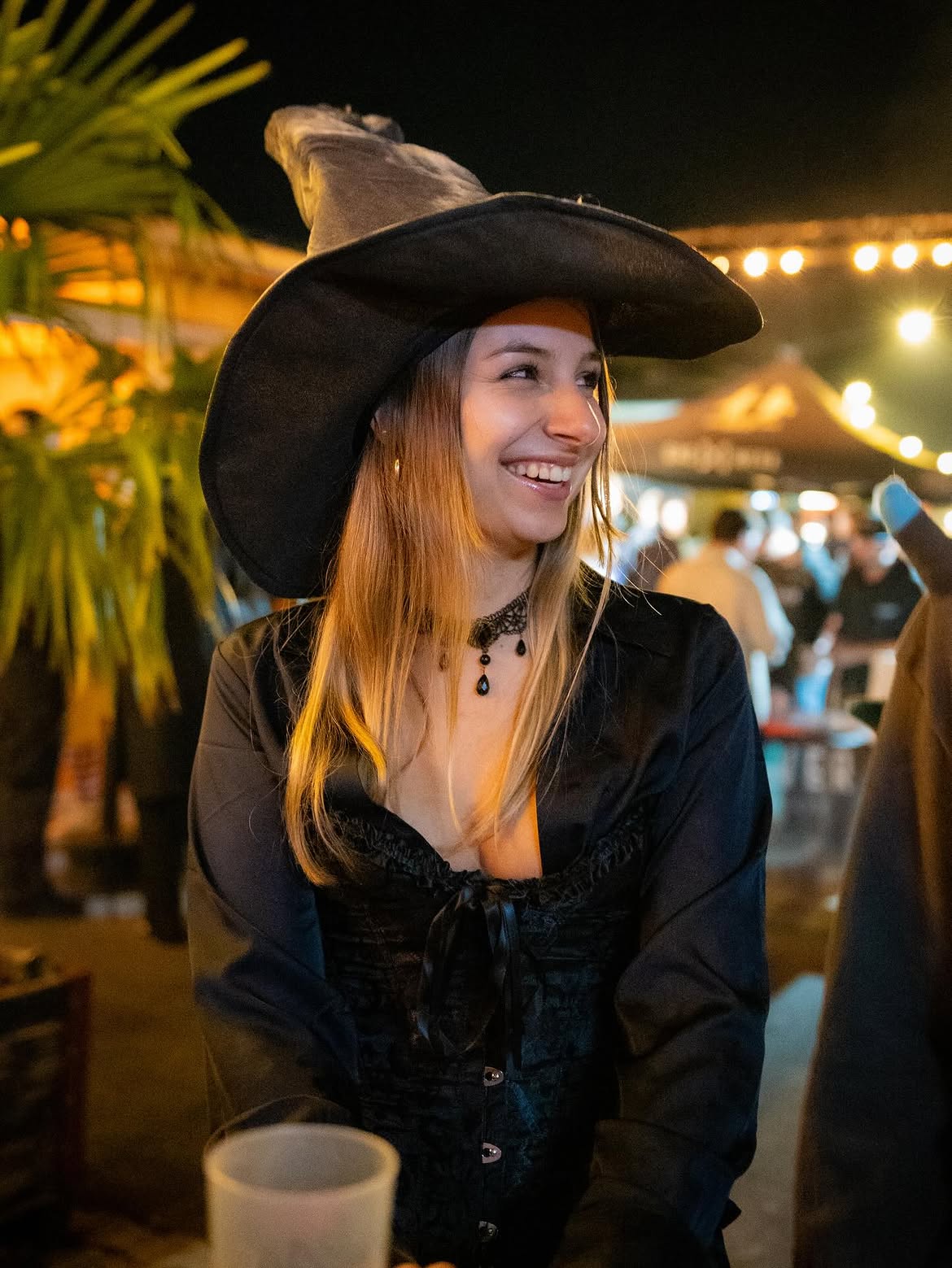 Sleek Witchy Vibes With Corset And Buckled Hat
