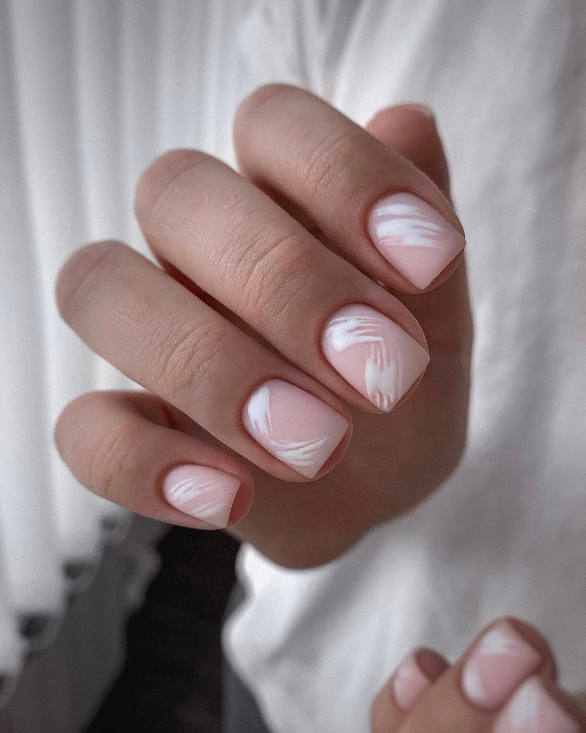Soft Pink Matte Nails with White Swirl Art