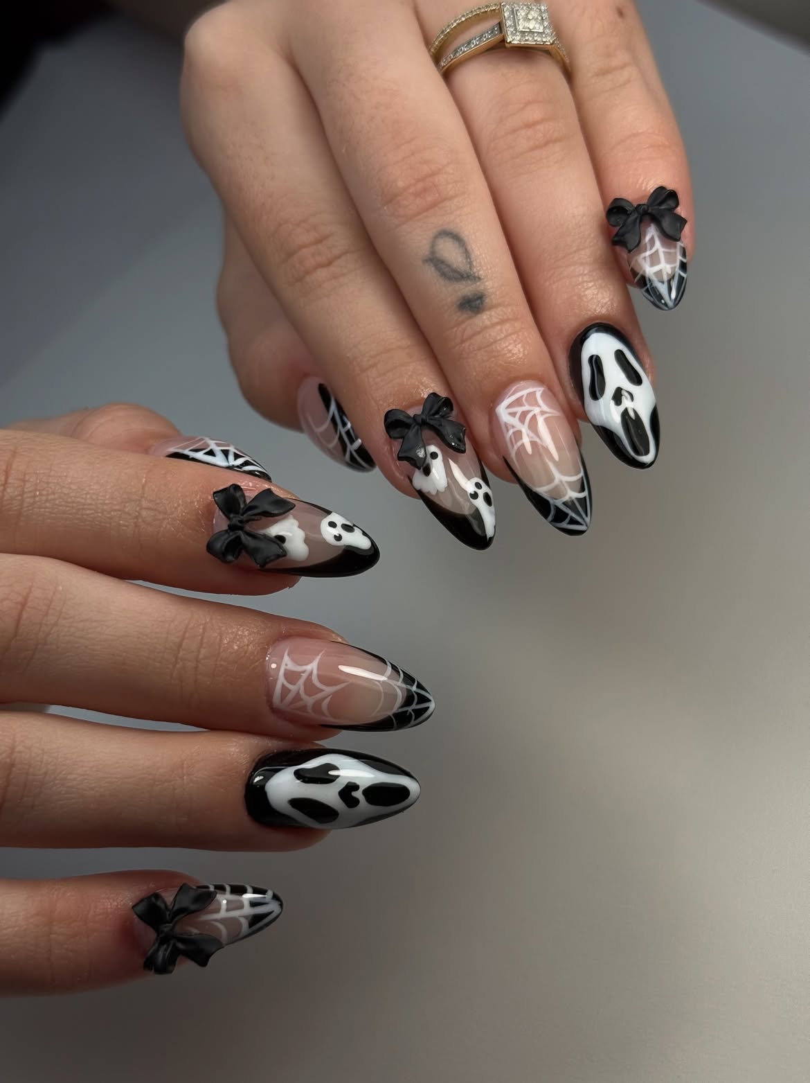 28 Spooktacular Halloween Nail Ideas You Need To Try 12 Spooky Ghost And Spiderweb Almond Nails