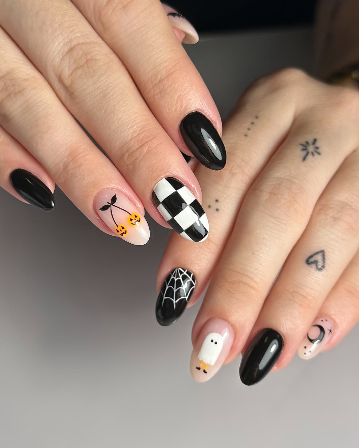 Spooky Halloween Nail Art with Ghosts and Pumpkins