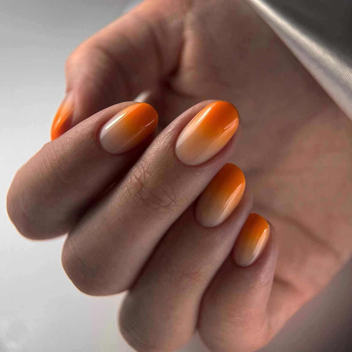 28 Stunning Orange Fall Nail Ideas You Need to Try 9 Sunset Orange Ombre Oval Nails