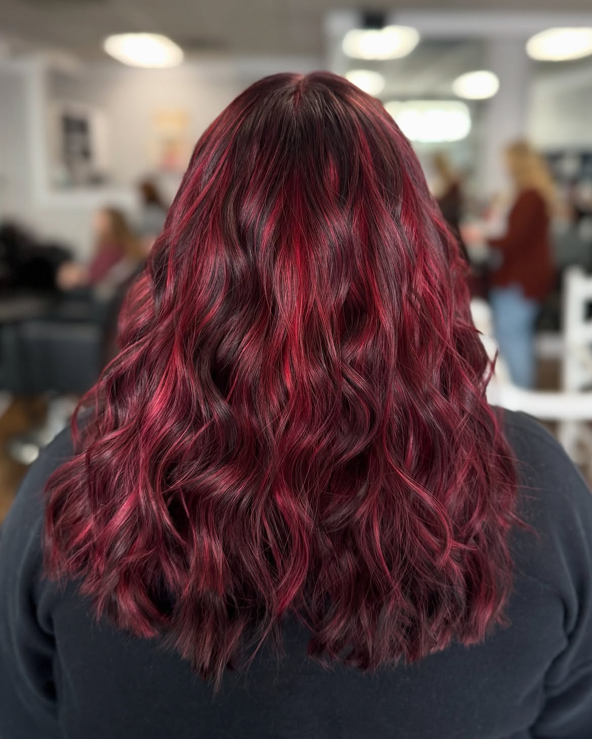 Vibrant Cherry Cola Balayage With Loose Waves