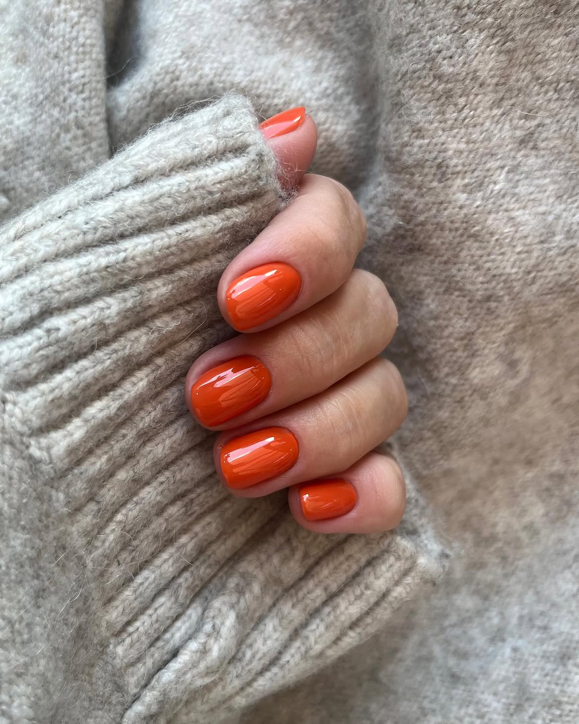 28 Stunning Orange Fall Nail Ideas You Need to Try 3 Vibrant Orange High-Gloss Short Oval Nails