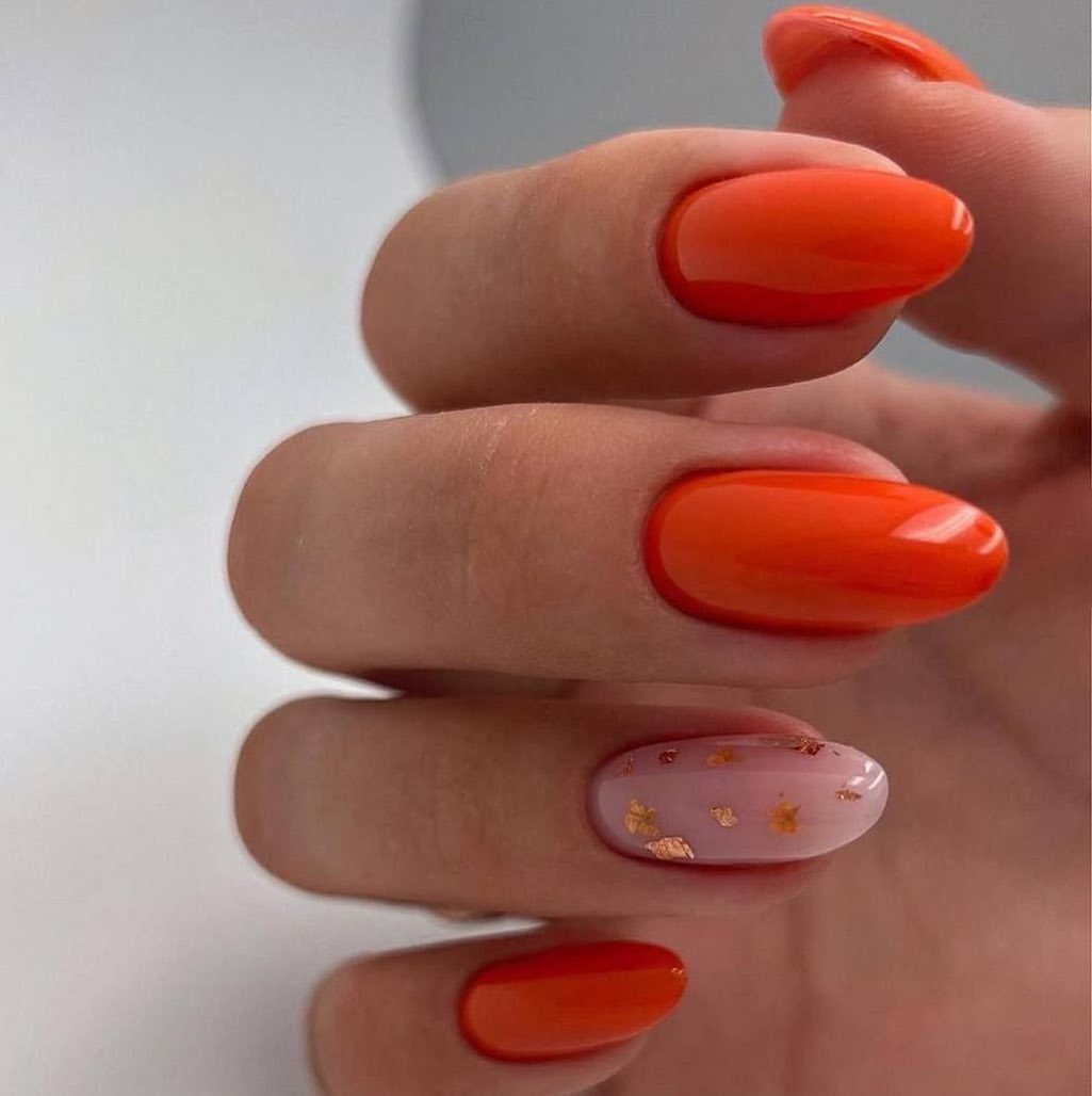 Vibrant Orange Oval Nails with Gold Leaf Accent