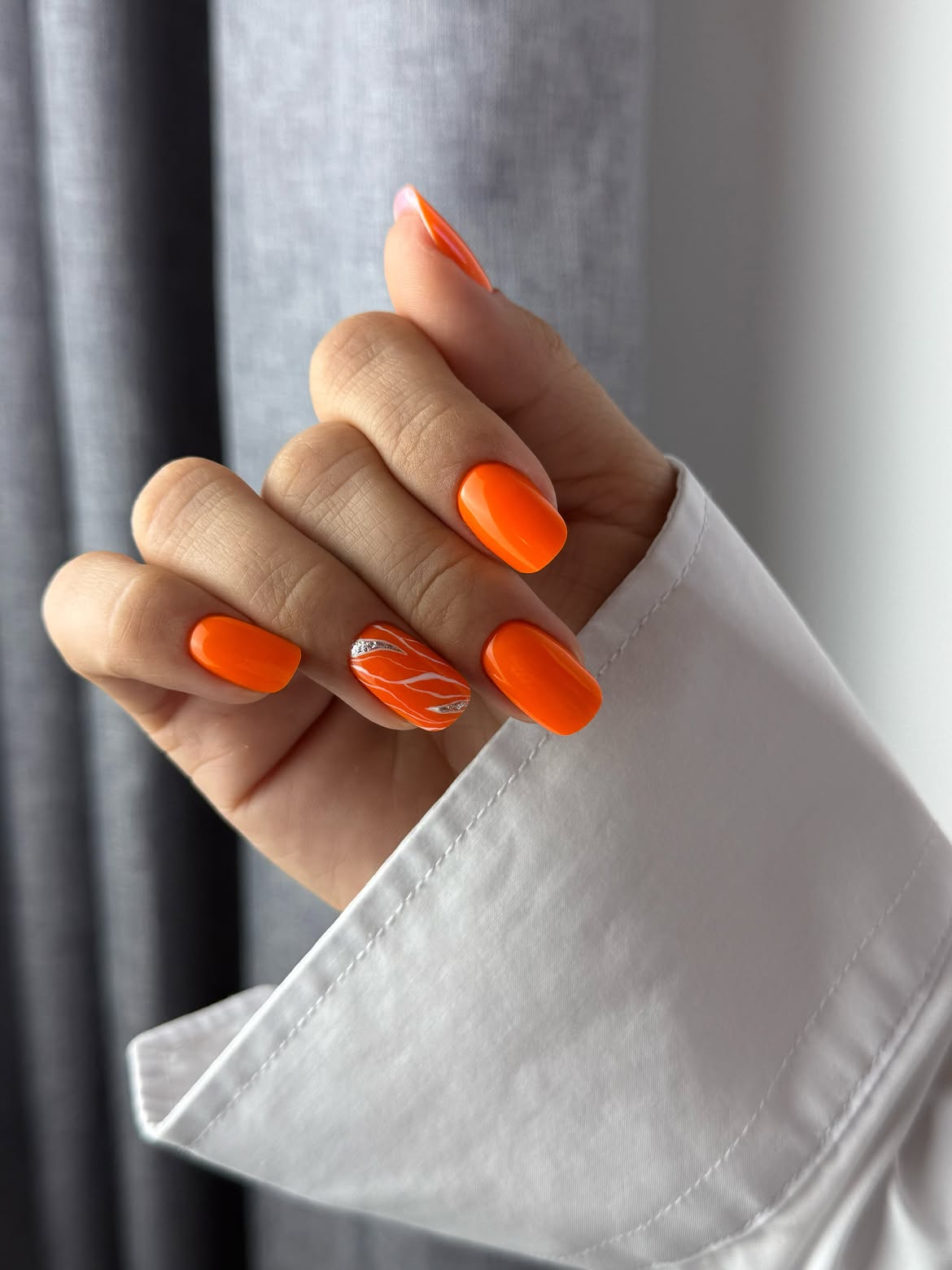 Vibrant Orange Swirl Accent Nails