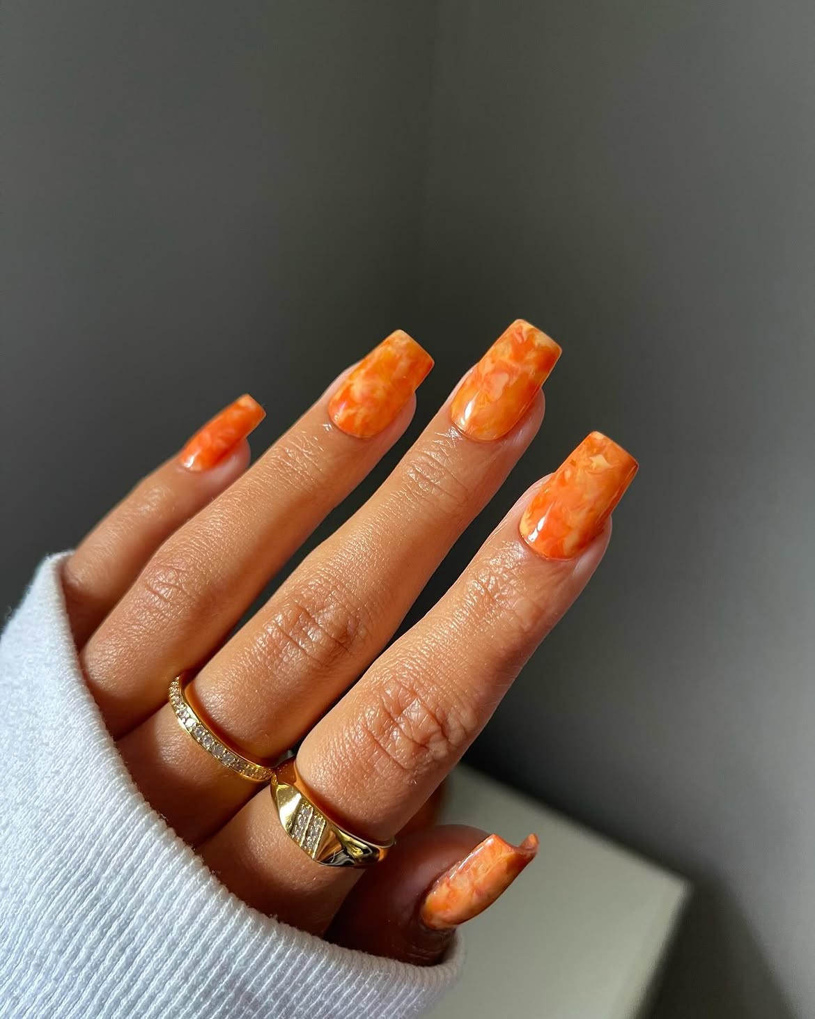 28 Stunning Orange Fall Nail Ideas You Need to Try 25 Vibrant Orange Swirl Glossy Square Nails