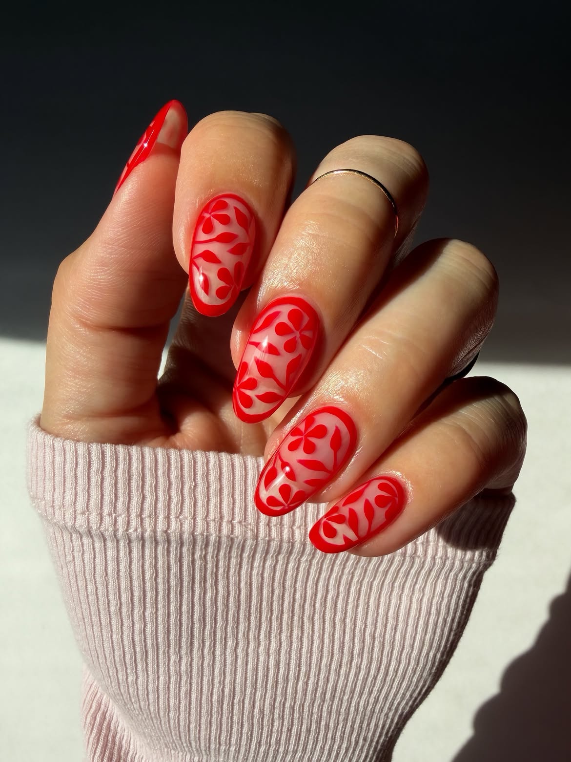 Vibrant Red Floral Outline Almond Nails