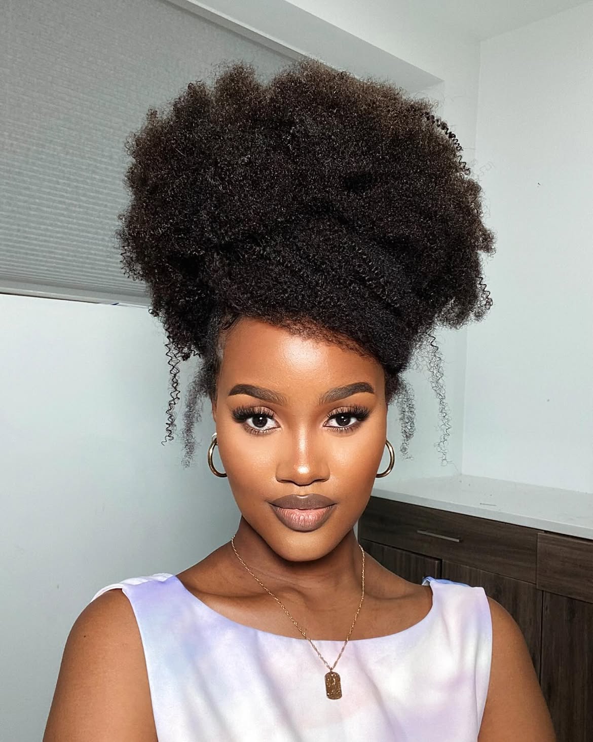 Voluminous High Puff With Defined Curls