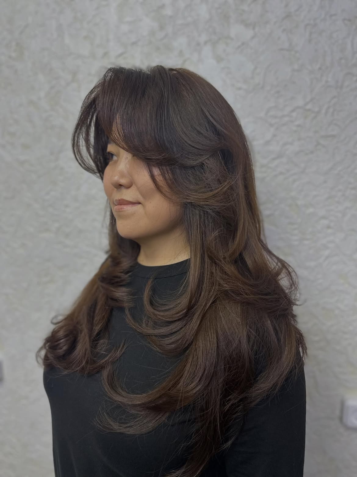 Voluminous Layered Brunette With Face-Framing Bangs