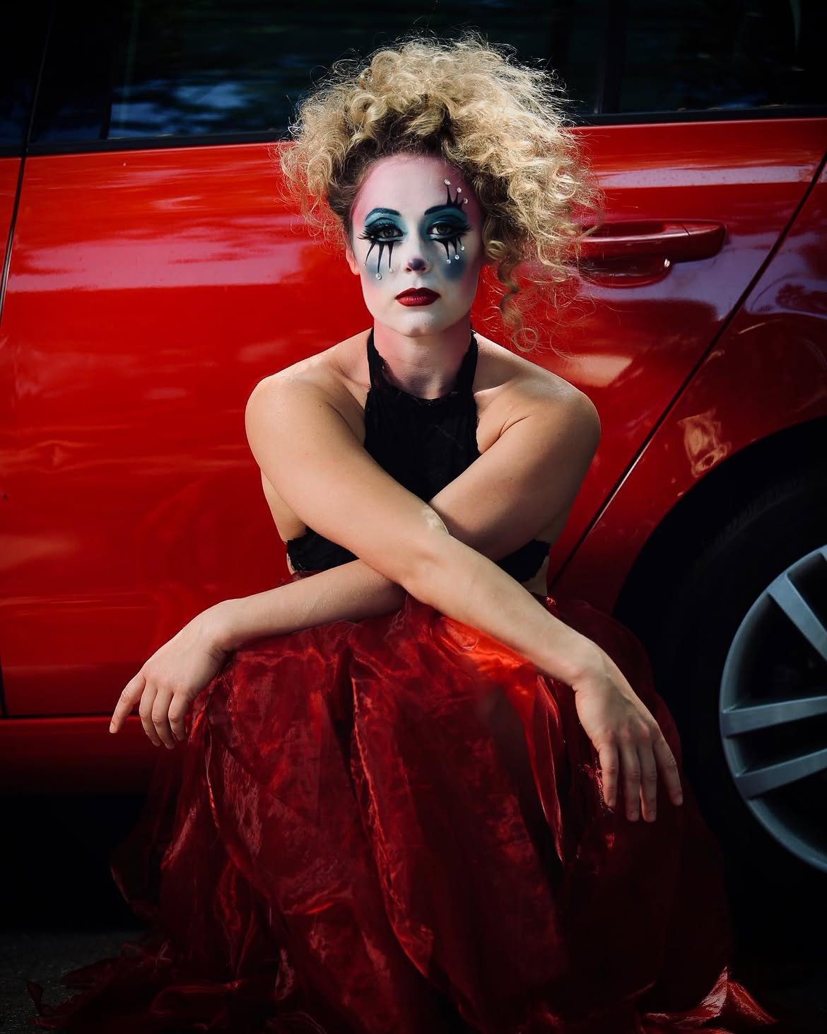 Voluminous Punk Curls With Dramatic Clown Makeup