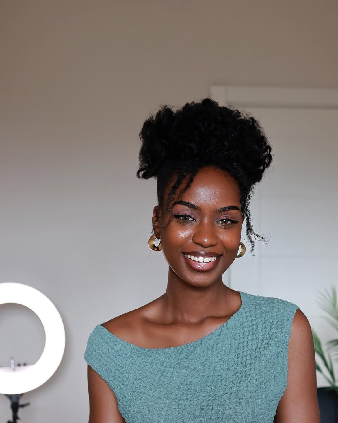 Voluminous Top Knot With Wispy Front Pieces