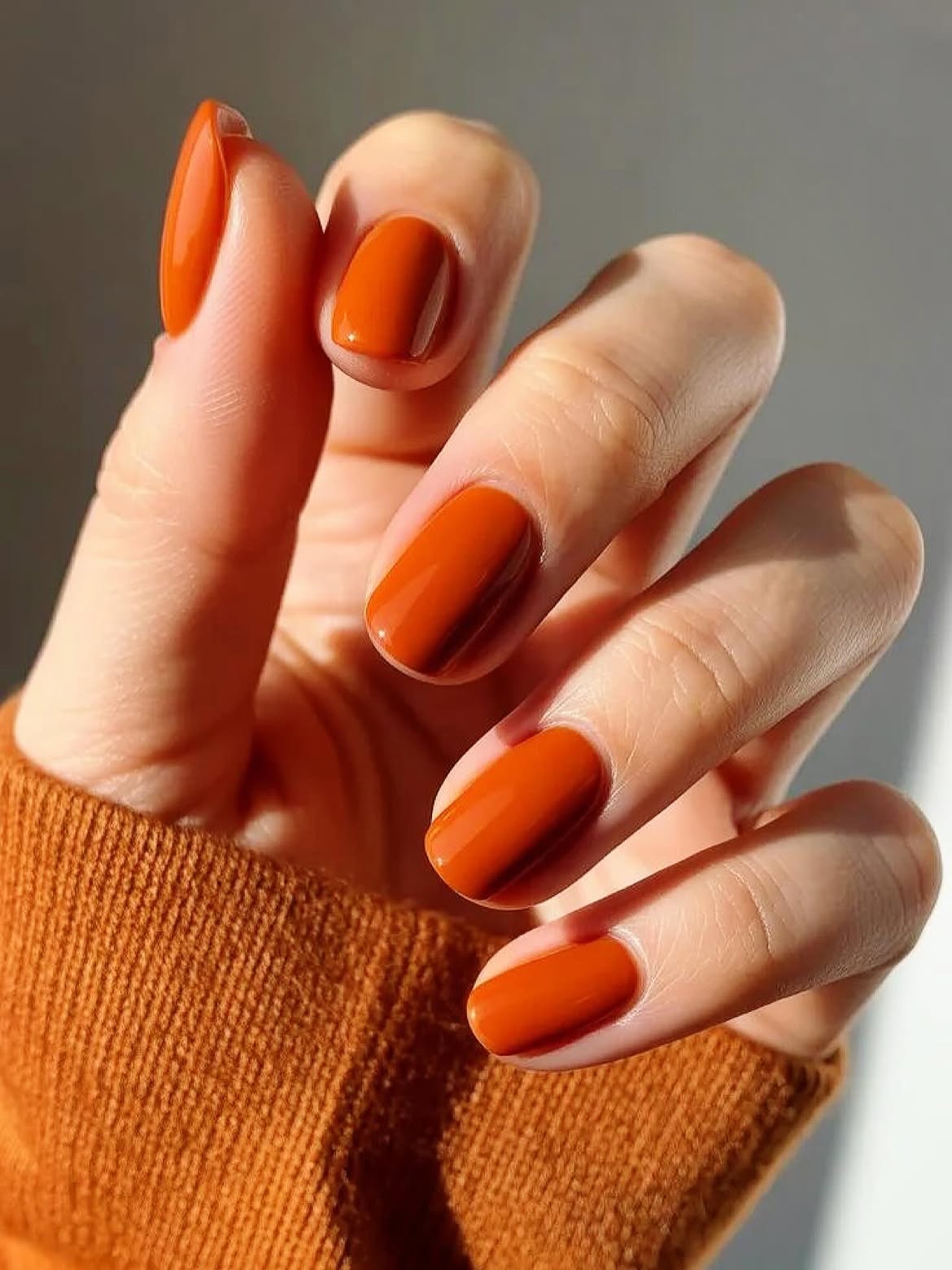 28 Stunning Orange Fall Nail Ideas You Need to Try 12 Warm Burnt Orange Glossy Medium Oval Nails
