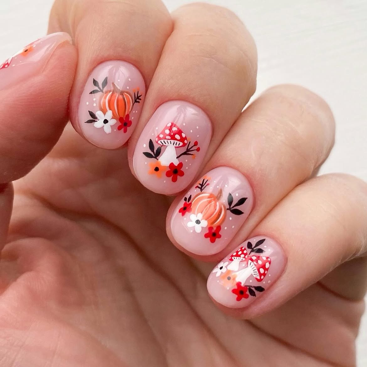 28 Stunning Pumpkin Nail Ideas for a Chic Fall Look 6 Whimsical Autumn Mushroom and Pumpkin Nail Art