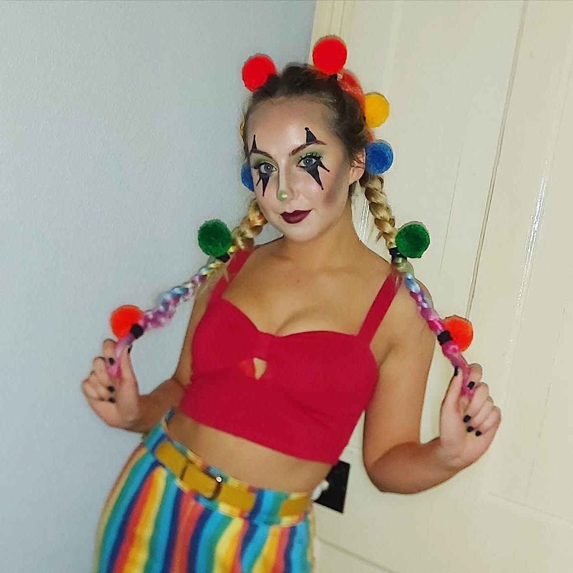Whimsical Clown Pigtails With Colorful Pom Poms