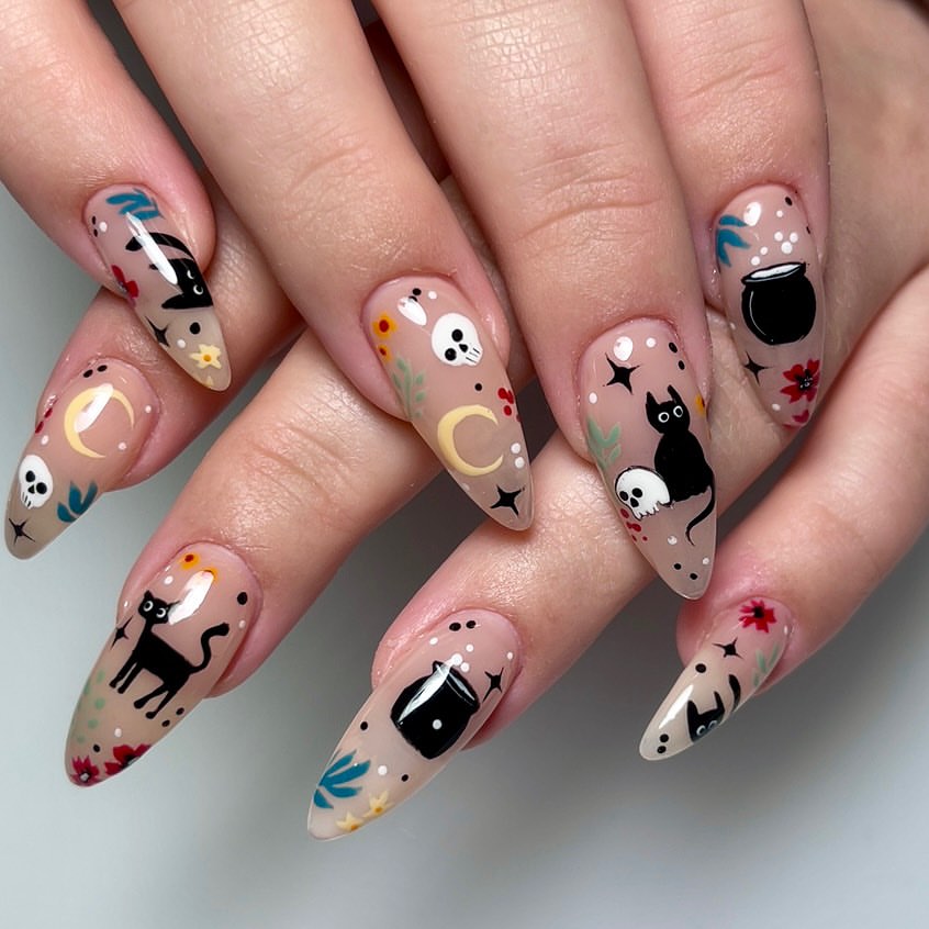 28 Spooktacular Halloween Nail Ideas You Need To Try 7 Whimsical Halloween Black Cat and Skull Nail Art