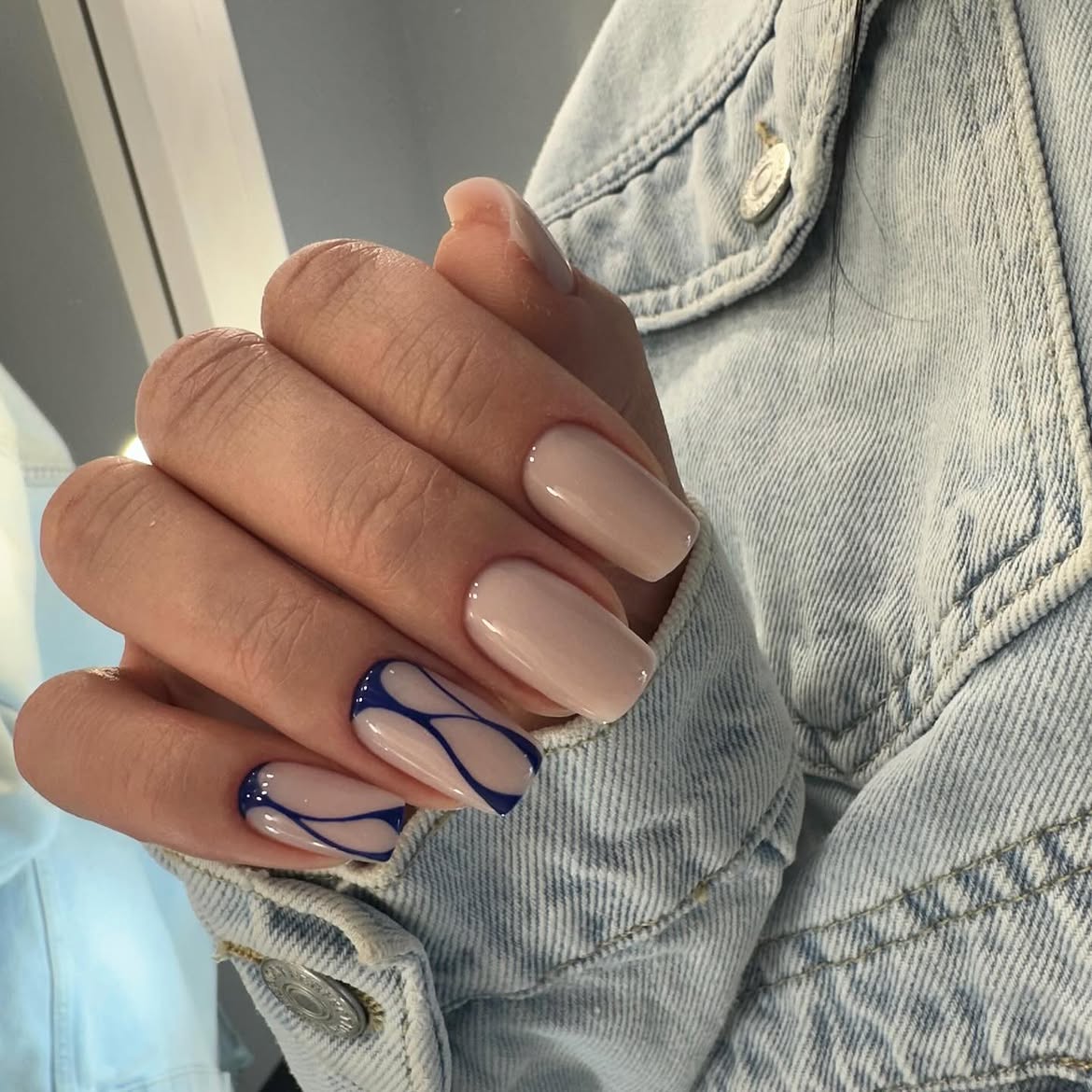 Beige Nails with Blue Swirl French Accent