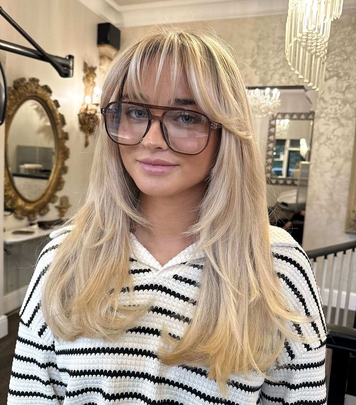 Blonde Face-Framing Layers With Wispy Bangs