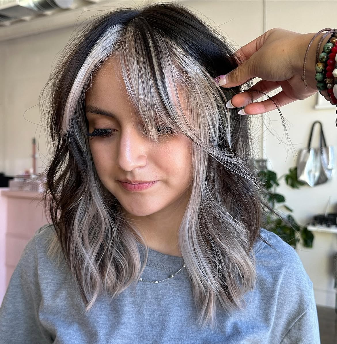 Bold Skunk Stripe Hair With Soft Waves
