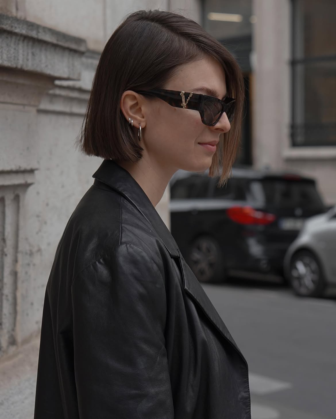 Chic Black Leather Blazer With Hoop Earrings
