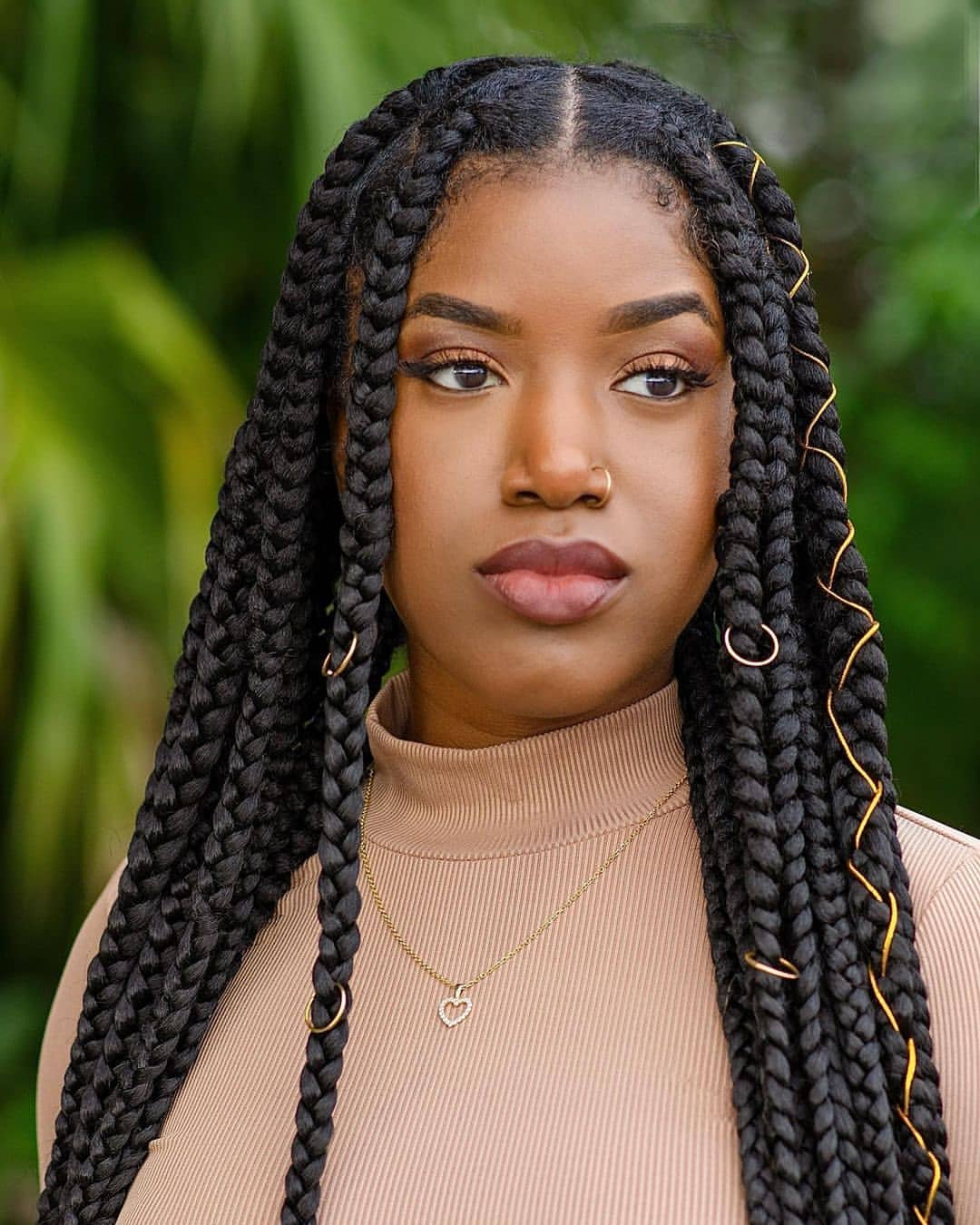 Chic Jumbo Braids With Gold Embellishments