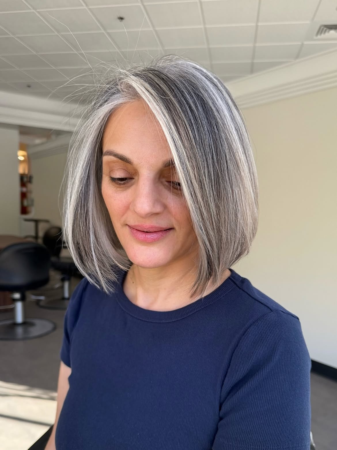 Chic Silver Streaks On Sleek Bob