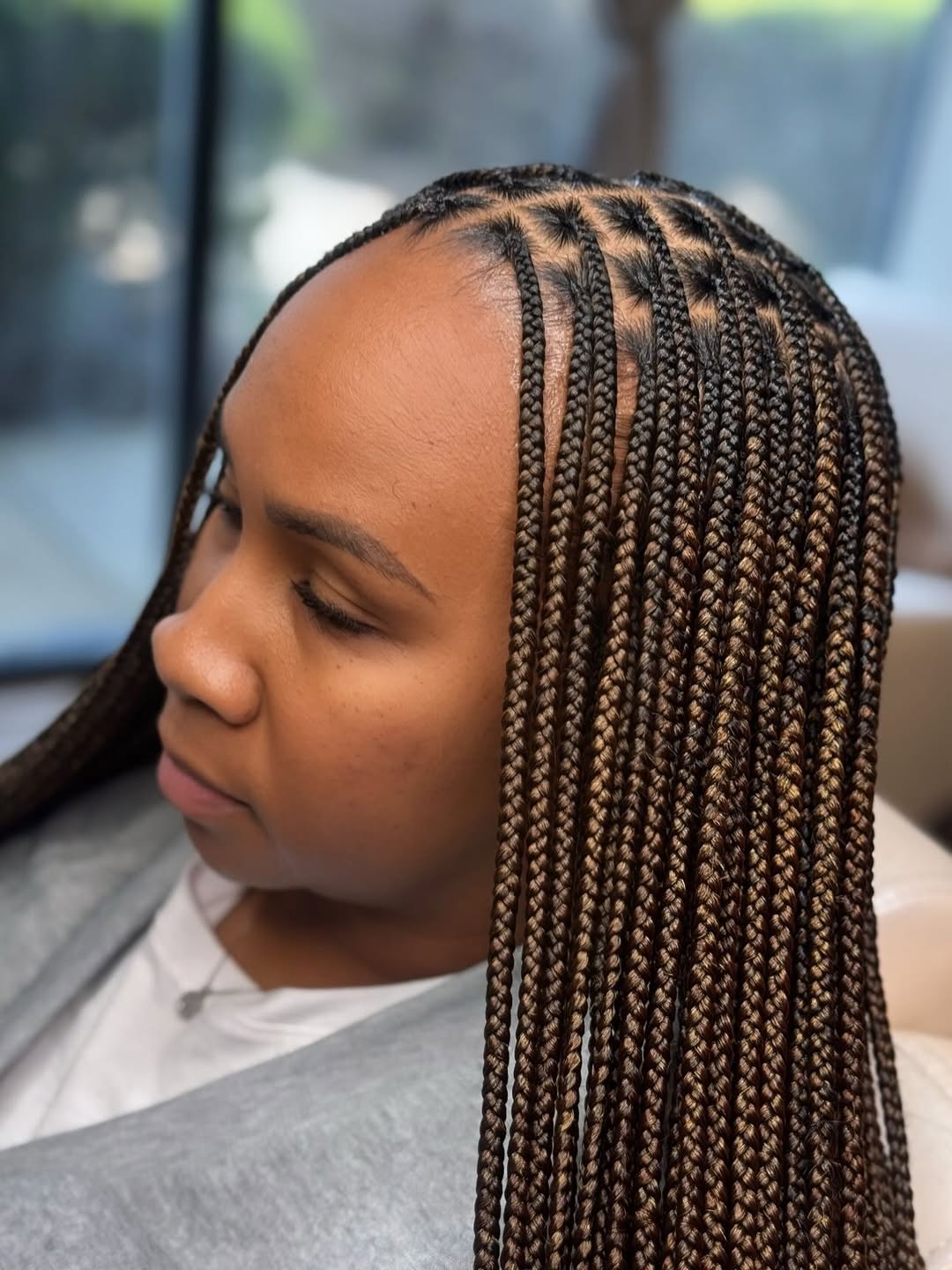 Chic Square-Parted Knotless Braids With Warm Brown Highlights