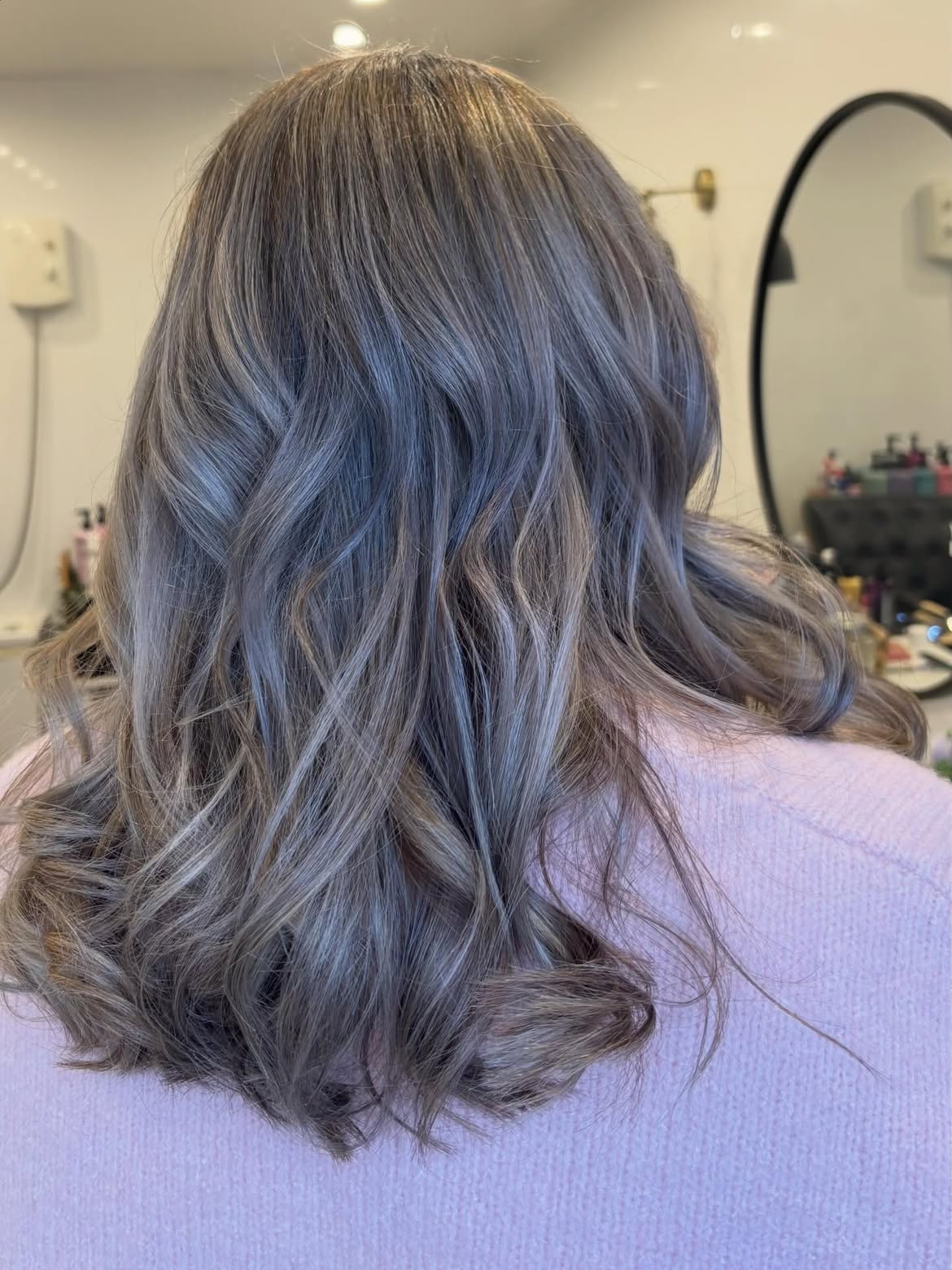 Cool-Toned Silver Streaks With Soft Beachy Waves