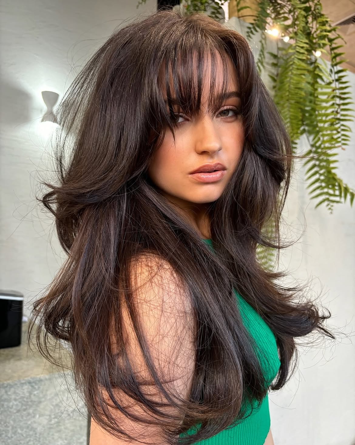 Dark Brunette Wispy Bangs With Voluminous Layers