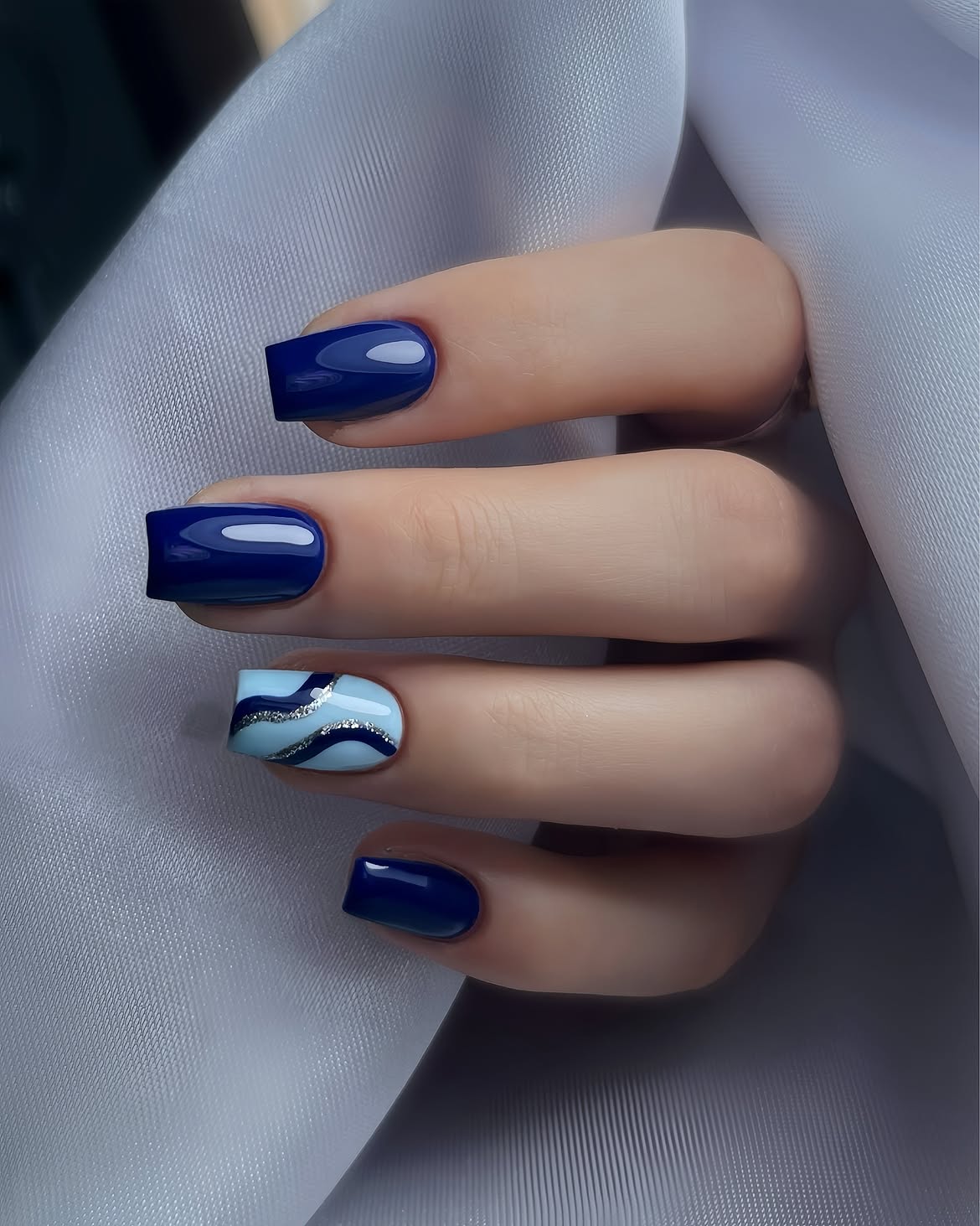 Deep Ocean Blue Glossy Square Nails with Swirl Art