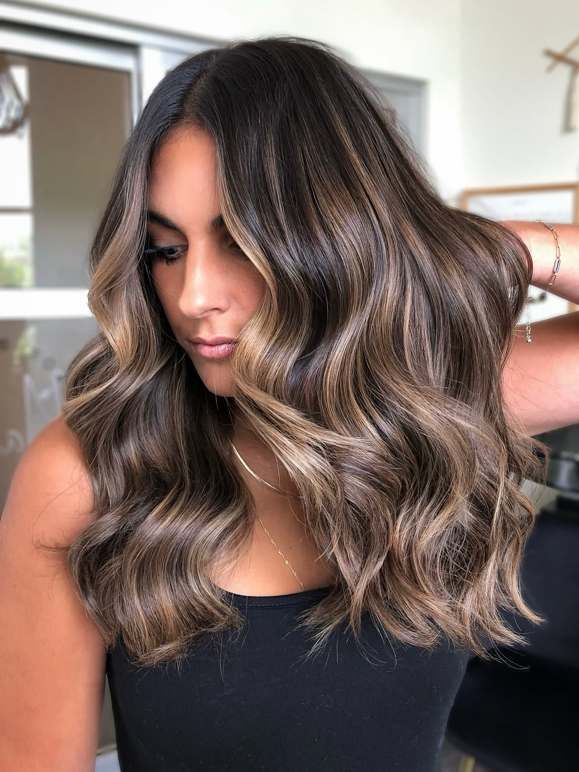 Dimensional Brunette Balayage With Soft Beach Waves