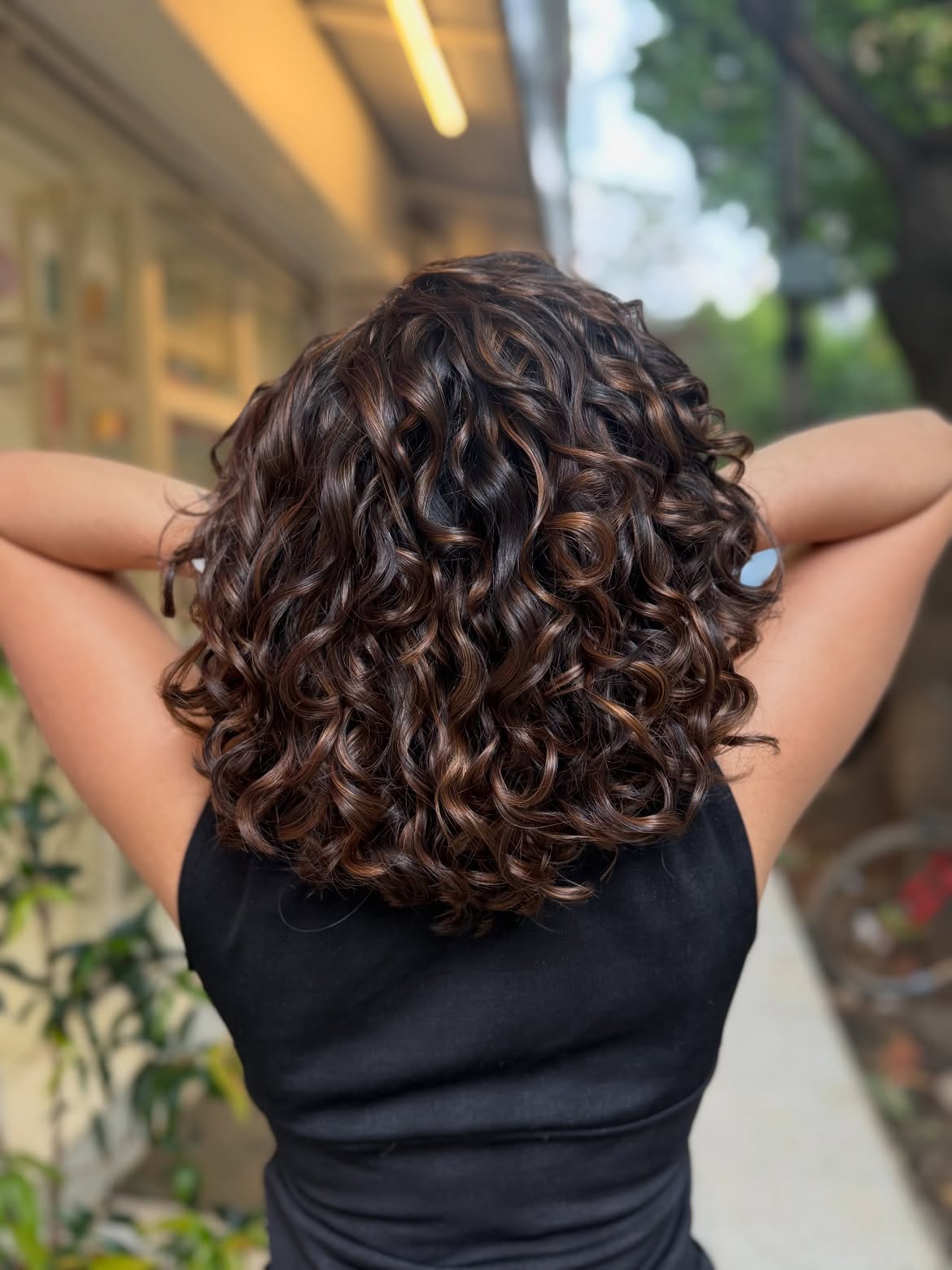 Dimensional Caramel Highlights On Layered Brown Curls