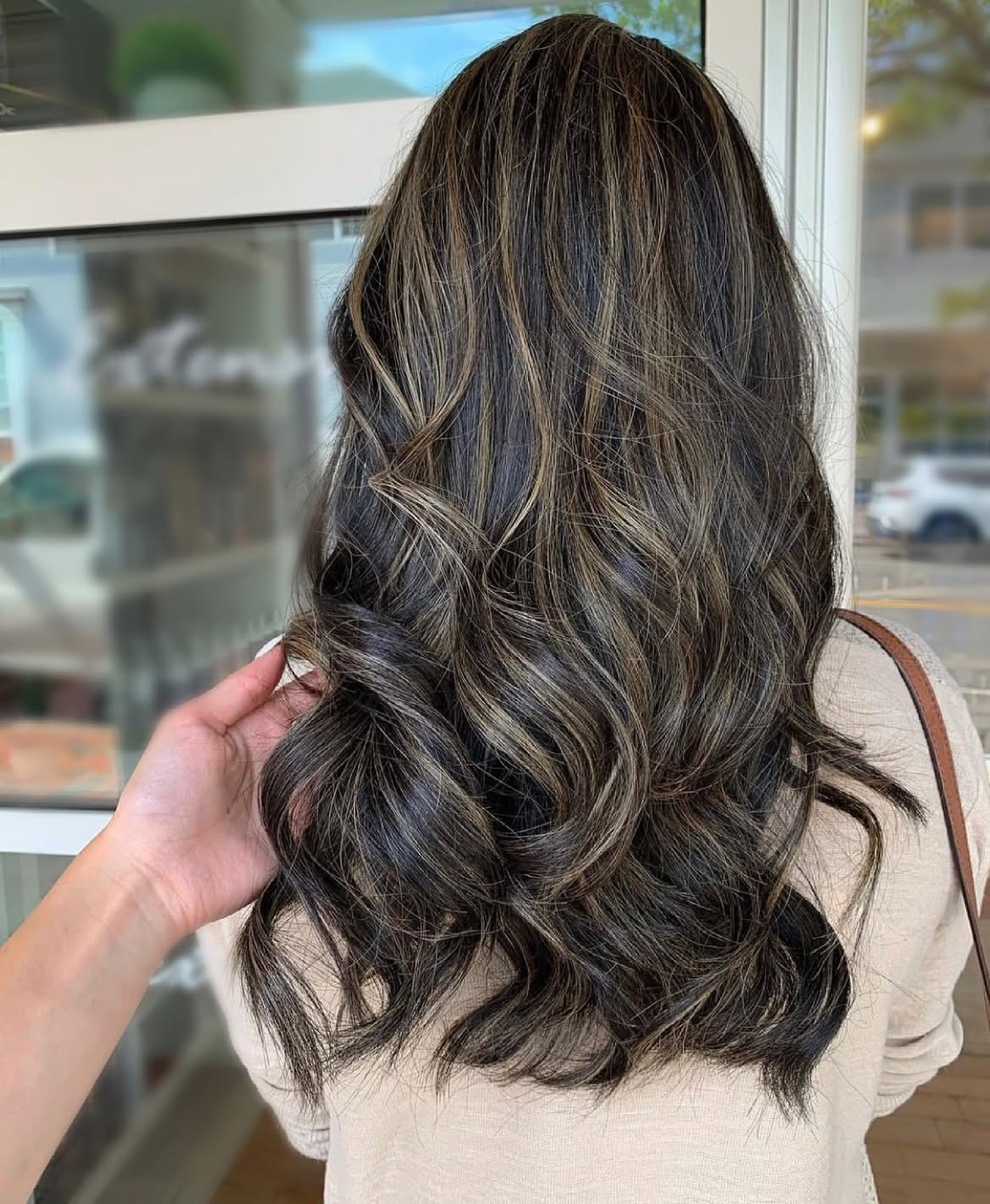 Dimensional Caramel Highlights On Long Black Waves