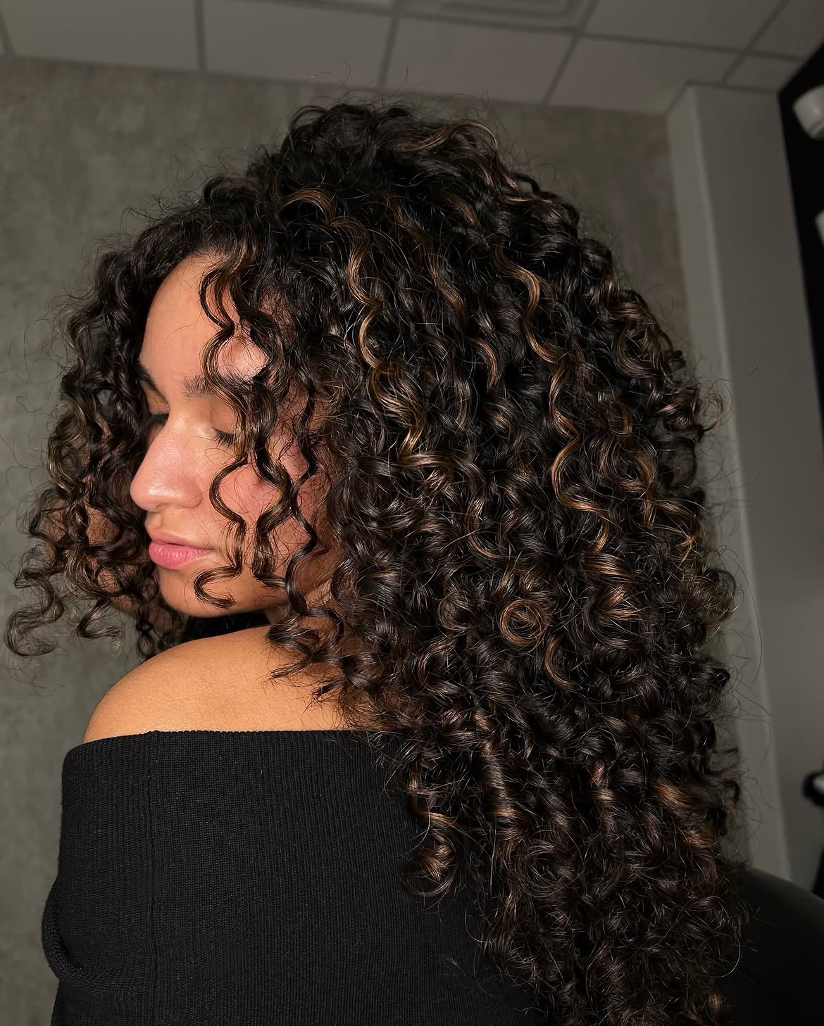 Dimensional Caramel Highlights On Long Curly Espresso Hair