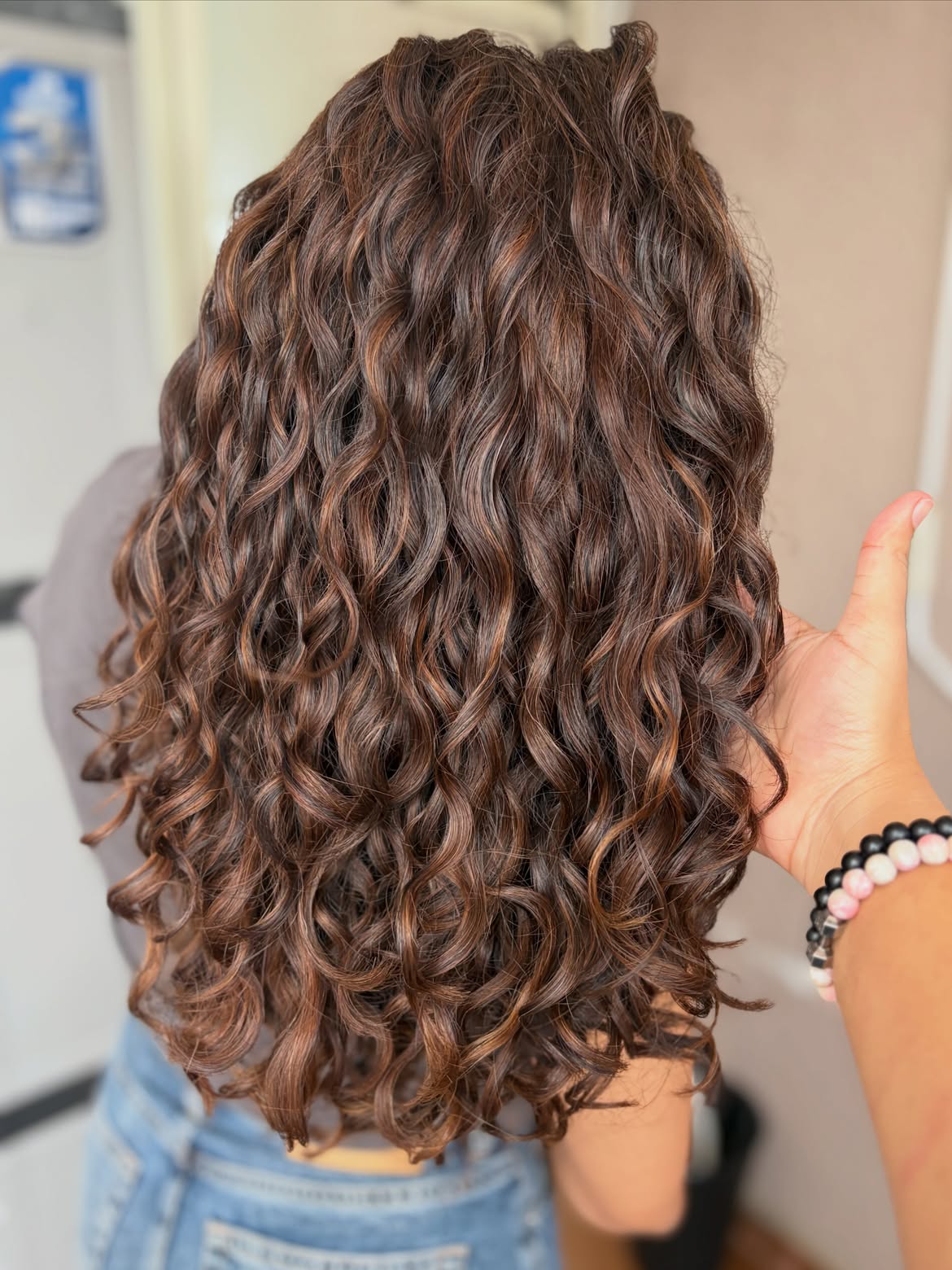 Dimensional Chocolate Brown Curls With Warm Highlights